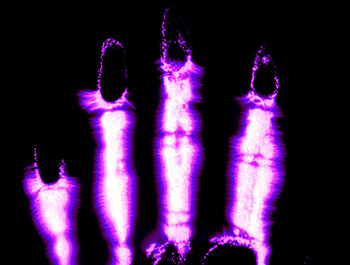 Palm with fingers spread   -   Wheaton, IL, 1975   -   Black & white Kirlian print, post-processed for color