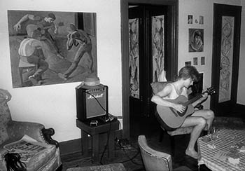 Paul Braucher with guitar & painting   -   New York City, 1985   -   Kodak infrared black & white 35mm film